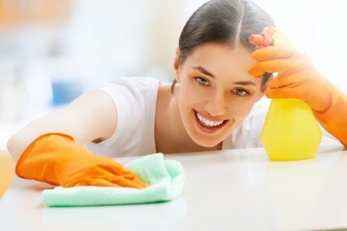 Staff wearing PPE during professional carpet cleaning