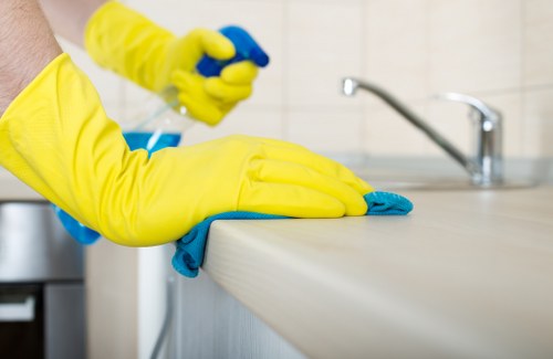 Insured carpet cleaning team working in a home interior